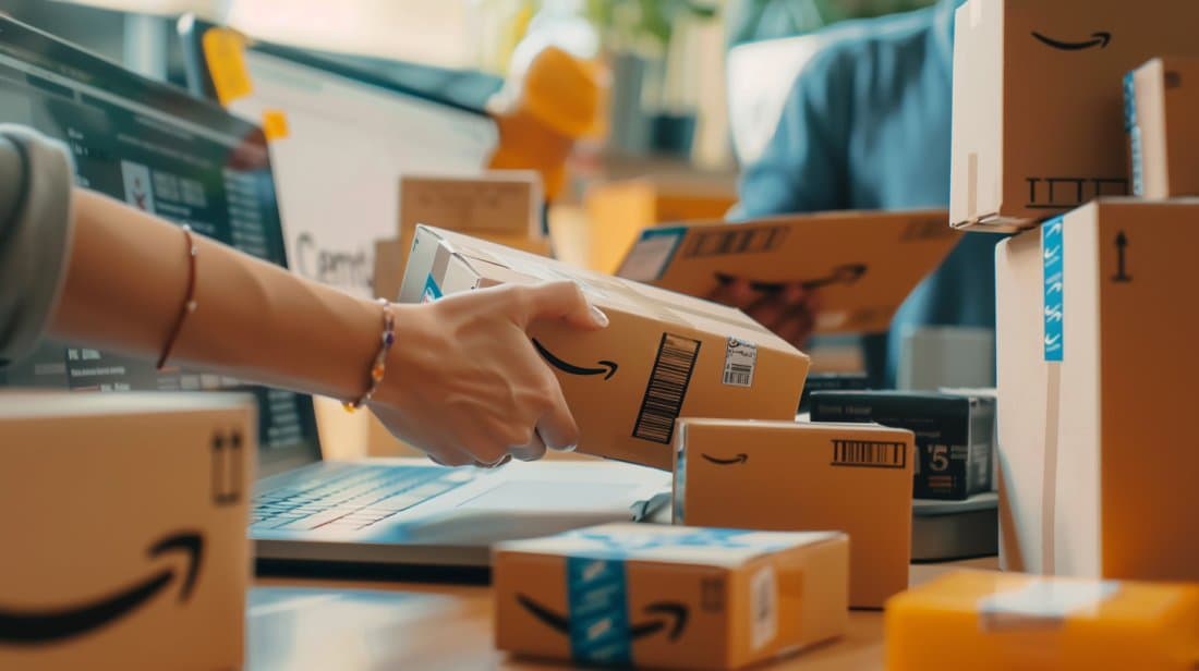 Amazon shipping boxes and laptop on desk